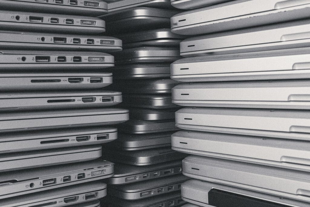 a room filled with lots of laptop computers